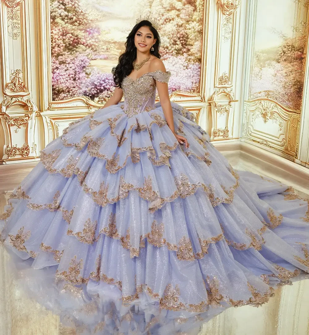 A young woman in a luxurious, layered lavender ball gown with gold accents, standing gracefully in a lavishly decorated room with ornate walls and floral backdrops.