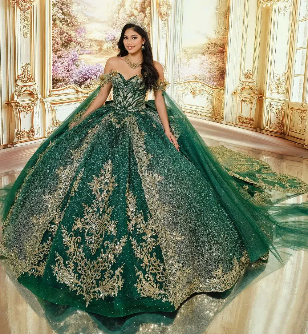 A woman in a stunning green ball gown with intricate gold embroidery, posing in an ornate, opulent setting.